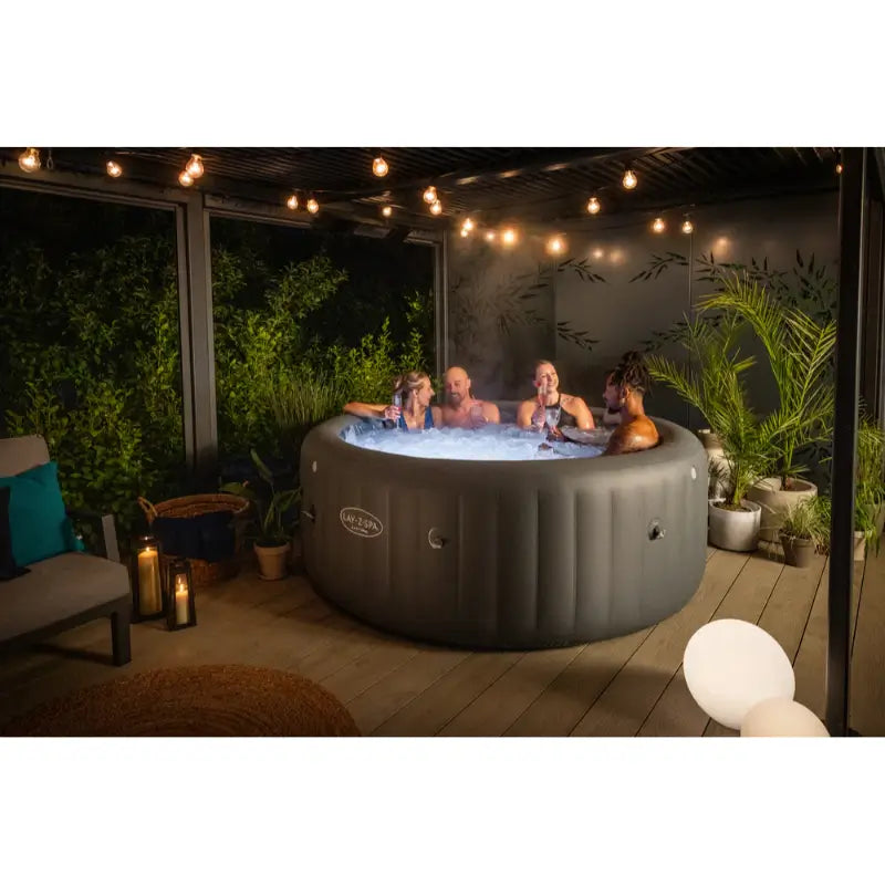 jacuzzi-lay-z-spa-santorini-hydrojet-pro-backyard-setup-with-a-group-of-people-enjoying