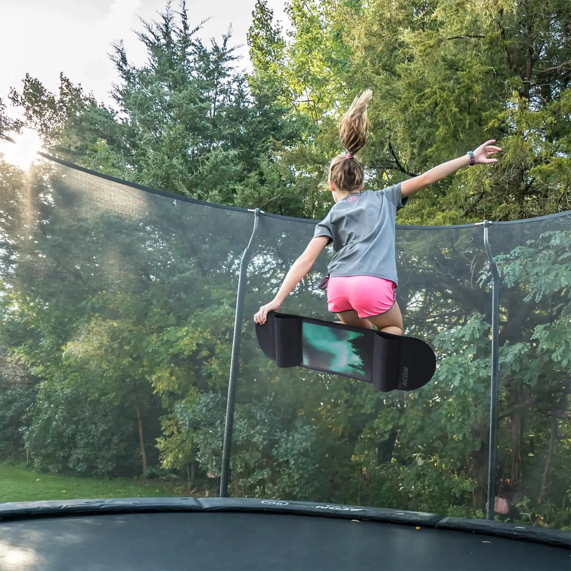 kid-using-acon-trampoline-skateboard-with-aurora-design