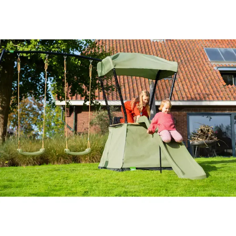 outdoor-shot-of-kids-enjoying-the-slide-on-exit-ivy-playset-with-swing-set-and-slide
