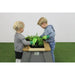lifestyle-shot-of-exit-aksent-kids-gardening-table-for-outdoor-play