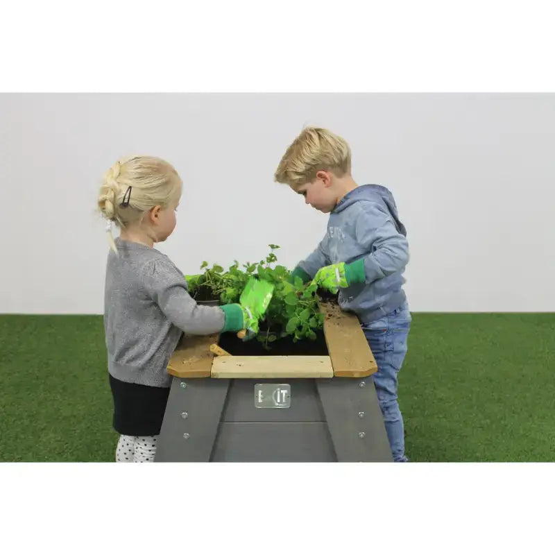 lifestyle-shot-of-exit-aksent-kids-gardening-table-for-outdoor-play