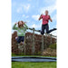kids-jumping-and-smiling-and-exit-interra-366cm-ground-level-trampoline-sits-flush-with-the-ground