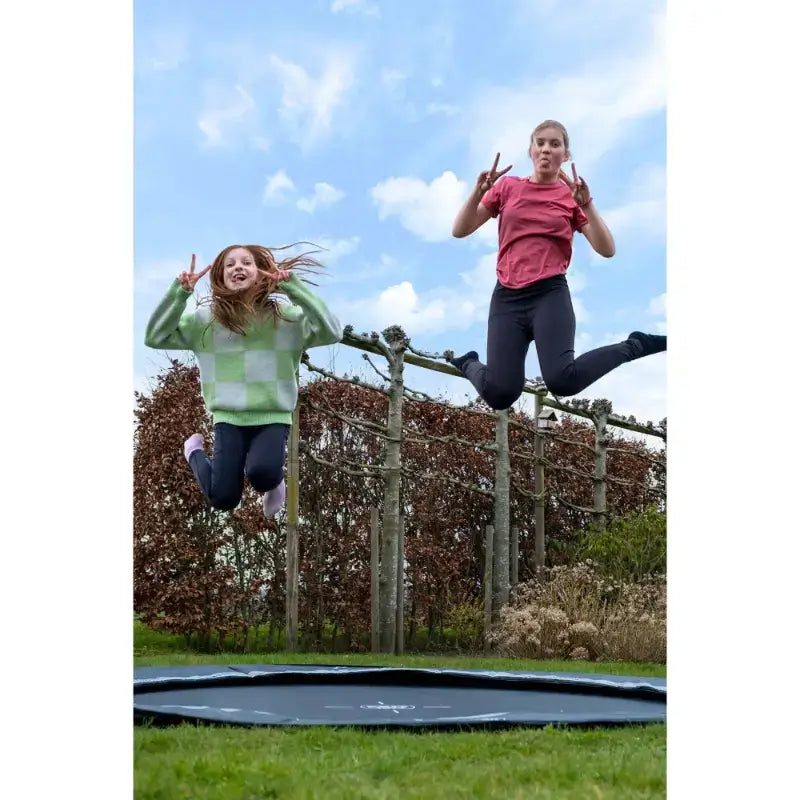 kids-jumping-and-smiling-and-exit-interra-366cm-ground-level-trampoline-sits-flush-with-the-ground