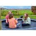 kids-relaxing-and-talking-on-exit-interra-ground-level-trampoline-uk-366cm-black