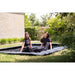 ladies-sitting-on-exit-interra-in-ground-rectangle-trampoline