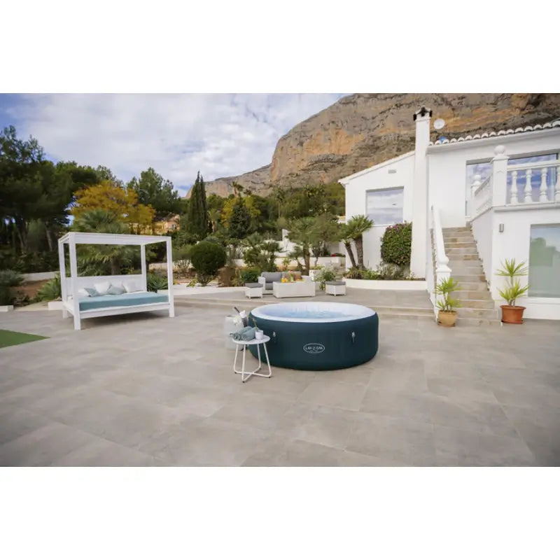 lay-z-spa-large-round-green-hot-tub-for-6-people-with-mountain-in-the-background