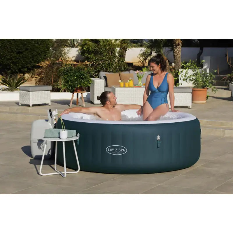 couple-soaking-in-lay-z-spa-new-york-airjet-insulated-hot-tub-and-energy-efficient