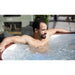 man-soaking-in-lazy-spa-helsinki-hot-tub-with-wood-color-rim