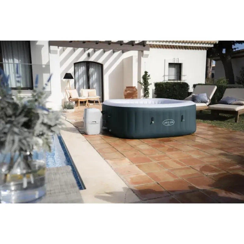 lazy-spa-ibiza-hot-tub-with-dark-green-exterior-walls-sitting-in-the-backyard