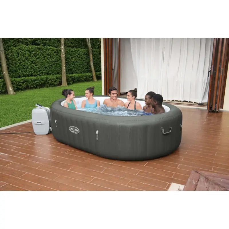 friends-soaking-in-lazy-spa-mauritius-oval-hot-tub-with-pump