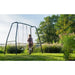lifestyle-view-of-exit-garden-swing-set-for-kids-with-trees-and-bush-in-the-background