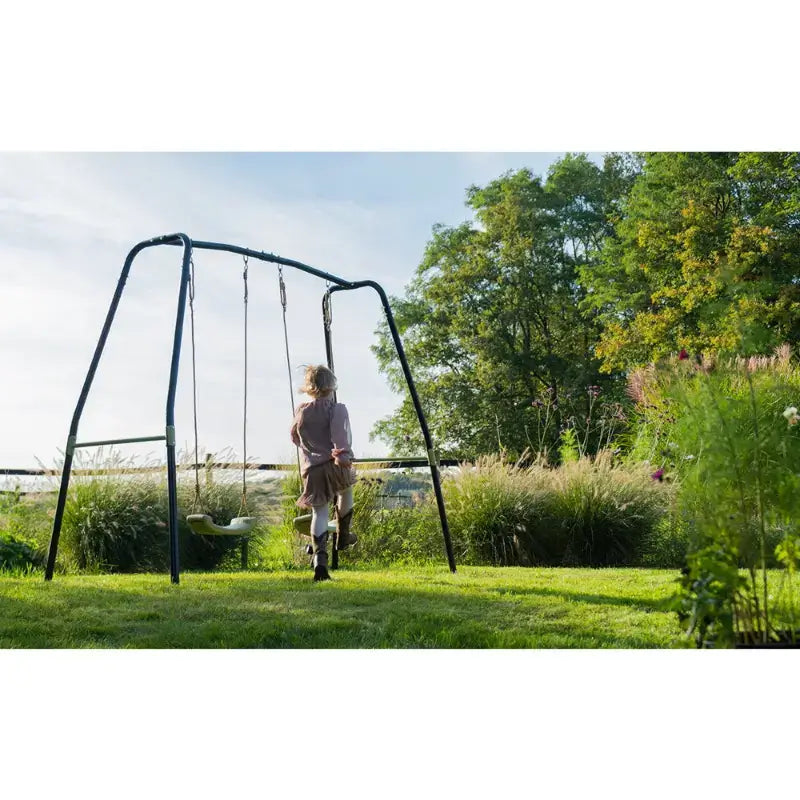 lifestyle-view-of-exit-garden-swing-set-for-kids-with-trees-and-bush-in-the-background