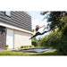 mid-air-shot-of-woman-with-exit-ground-level-trampoline-UK