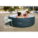 new-york-airjet-hot-tub-with-white-rim-and-dark-green-exterior-wall