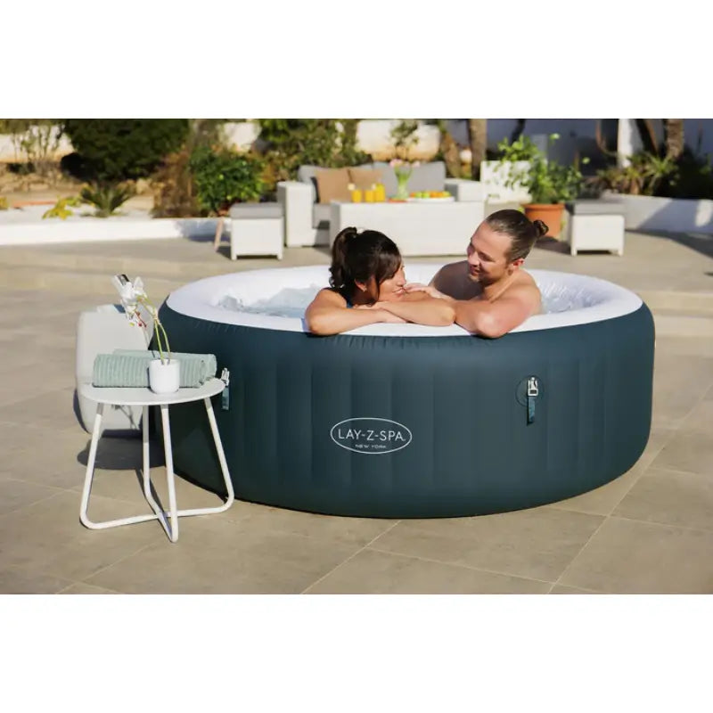 new-york-airjet-hot-tub-with-white-rim-and-dark-green-exterior-wall