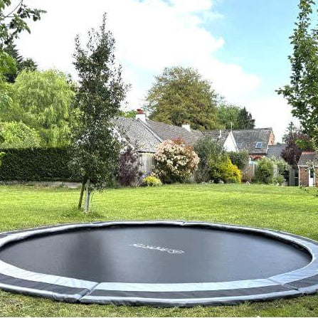 north-14ft-round-inground-trampoline-installed-in-large-garden