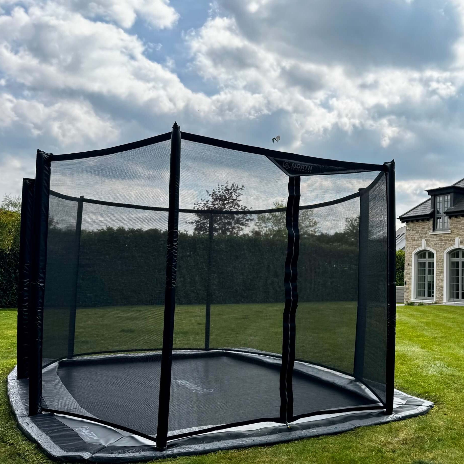 north-15ft-x-10ft-rectangular-trampoline-with-safety-net-in-large-garden