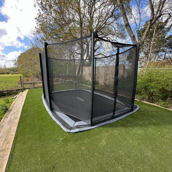 north-17ft-x-12ft-rectangular-inground-trampoline-with-safety-net-installed-in-garden