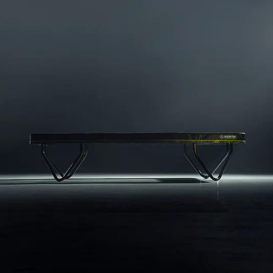 north-athlete-trampoline-front-view-on-dark-studio-background