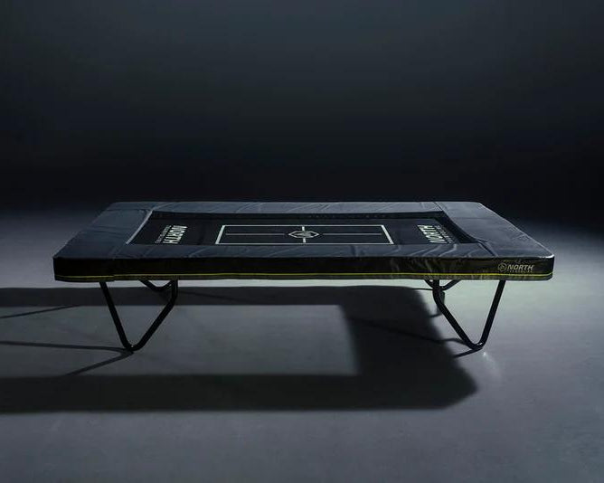 north-athlete-trampoline-top-view-on-dark-studio-background_8bdee6f9-53c7-458e-b5b1-44ba3774976e