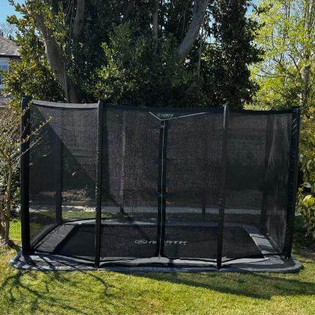 north-rectangular-inground-trampoline-with-black-safety-net-in-garden