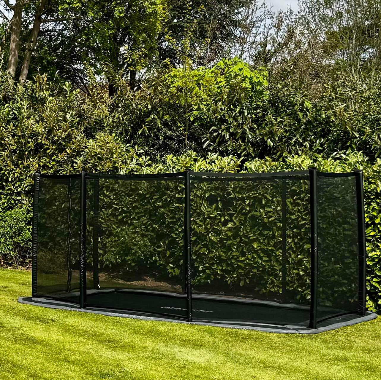 north-rectangular-trampoline-with-safety-net-next-to-garden-seating-area