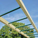 overhead-view-of-green-monkey-bars-attached-to-wooden-lookout-tower