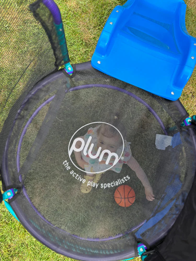 overhead-view-of-round-bounce-mat-with-child-below