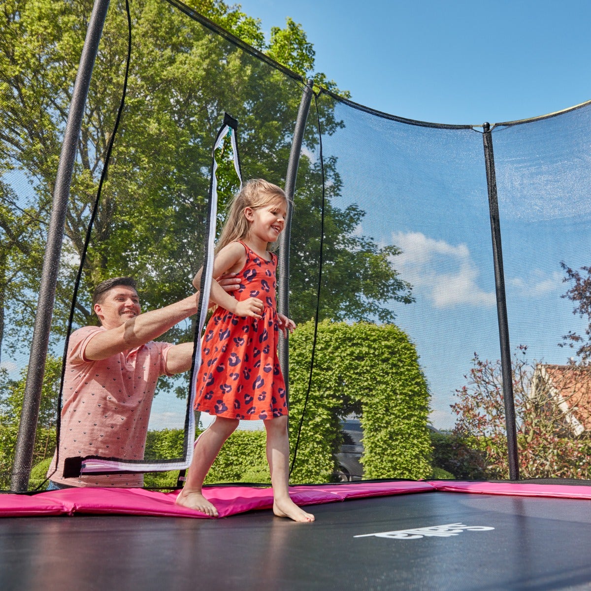 parent-helping-child-enter-salta-pink-rectangular-trampoline