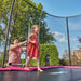 parent-helping-child-enter-salta-pink-rectangular-trampoline