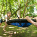 perspective-view-of-children-playing-on-the-plum-spider-monkey-wooden-double-swing-set-in-a-residential-garden