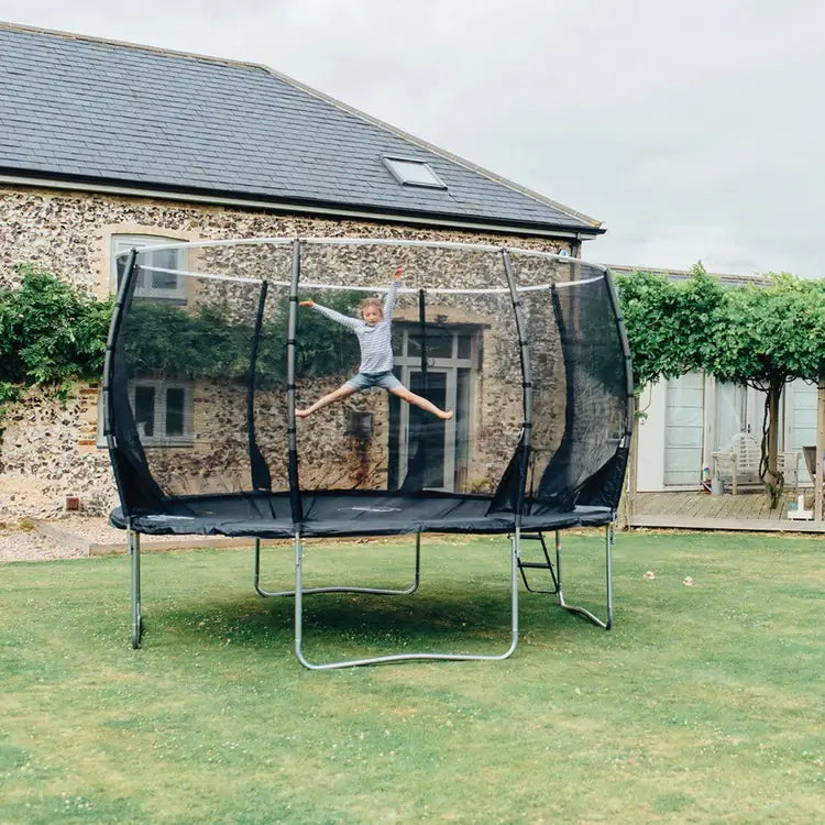 plum-magnitude-trampoline-in-garden-lifestyle-shot