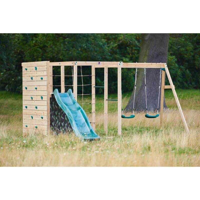 plum-wooden-climbing-cube-with-slide-rock-climbing-wall-and-double-swing-set-in-a-field