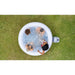 above-shot-of-round-cancun-hot-tub-with-pump-placed-on-grass
