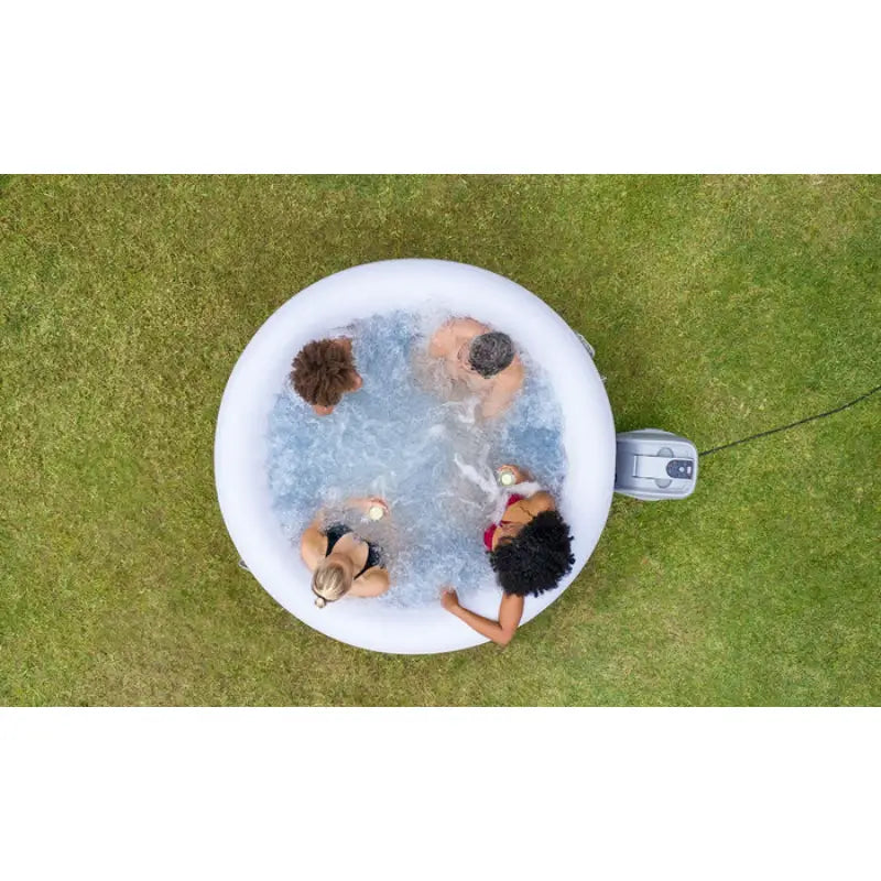 above-shot-of-round-cancun-hot-tub-with-pump-placed-on-grass