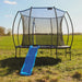 round-outdoor-trampoline-with-blue-slide-front-view-in-field