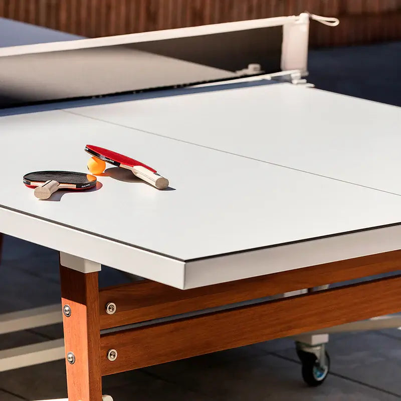 close-up-view-of-rs-barcelona-folding-ping-pong-table-top-with-paddles-and-ball-on-the-surface