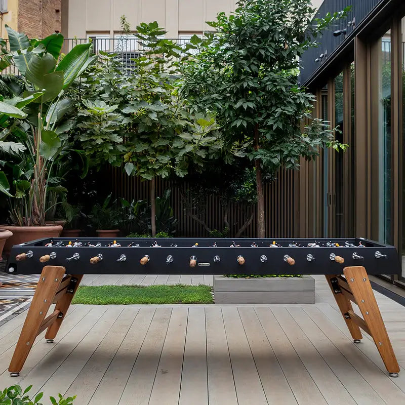 full-view-of-rs-barcelona-max-indoor-and-outdoor-foosball-table-with-plants-in-the-background