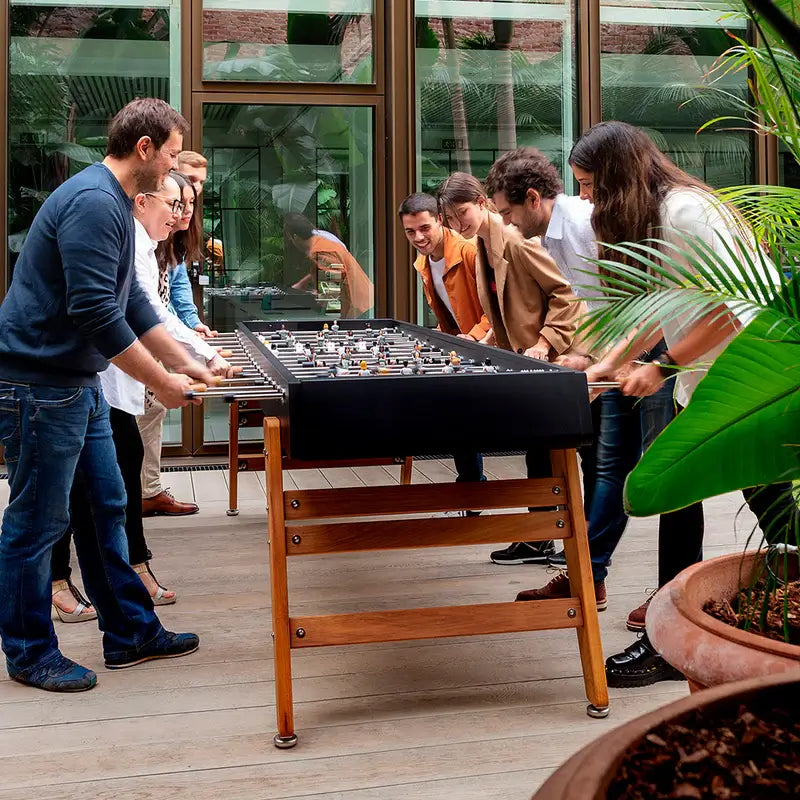 side-view-of-rs-barcelona-max-outdoor-foosball-table-with-eight-players-enjoying-the-game