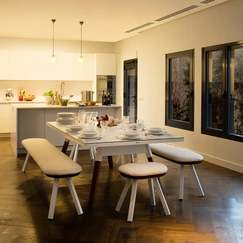 rs-barcelona-ping-pong-table-dining-set-up-with-cushioned-seats-and-plates-on-the-tabletop
