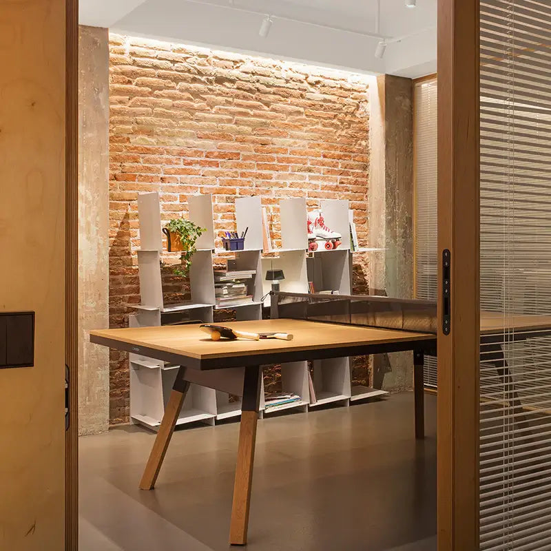 rs-barcelona-you-and-me-ping-pong-table-in-a-room-with-displays-in-the-background