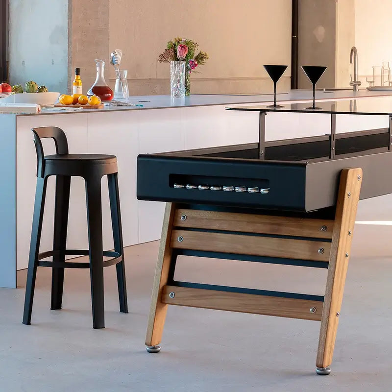 side-detail-of-rs-track-dining-shuffleboard-barcelona-table-showing-iroko-legs-and-pucks-in-the-scoring-zone