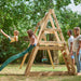 side-view-of-children-playing-on-plum-tamarin-wooden-climbing-frame-with-slide-and-swings
