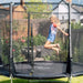side-view-of-girl-jumping-inside-plum-spacezone-ii-evolution-trampoline