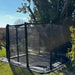 side-view-of-north-rectangular-inground-trampoline-with-black-safety-net