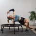 stretching-on-jumpsport-370-pro-with-6-arched-legs-and-elastic-bungee-cords
