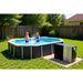thermotec-edge-pool-heat-pump-next-to-round-above-ground-pool-with-children