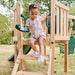 toddler-climbing-down-wooden-playcentre-steps-holding-toy-telephone