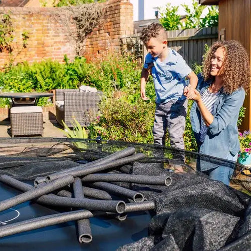 woman-and-child-removing-plum-spacezone-ii-evolution-springsafe-trampoline-poles