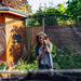 woman-installing-plum-spacezone-trampoline-enclosure-pole